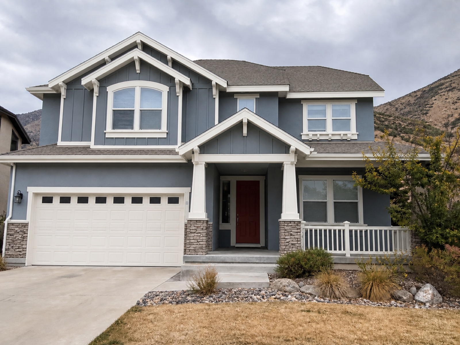 Representative view of the same home after a full exterior repaint, with clean, even color