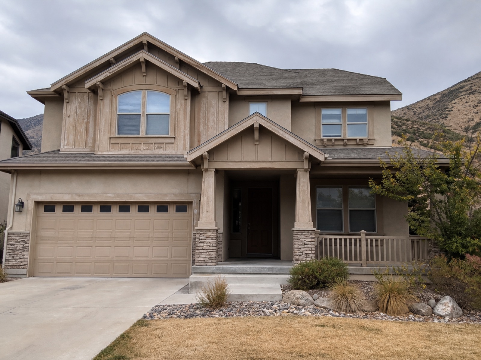 Representative home exterior before repainting, with faded and worn paint
