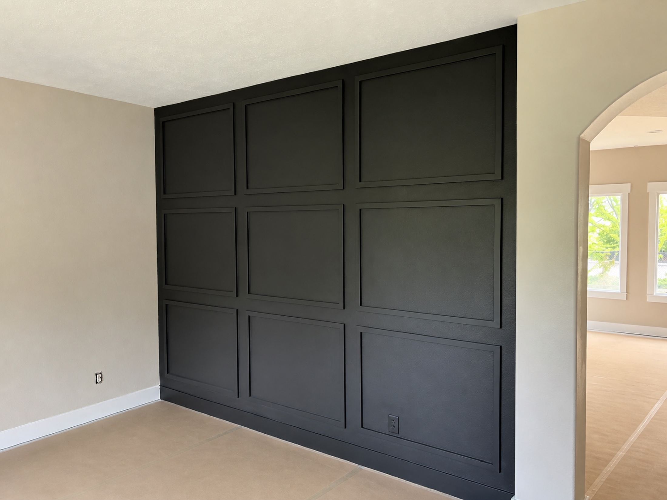 Finished charcoal paneled feature wall from an MEC Painting project